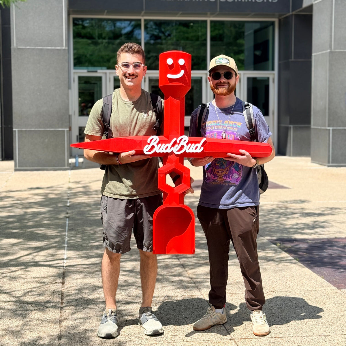 Andrew and Xander holding an oversized 4ft BudBud